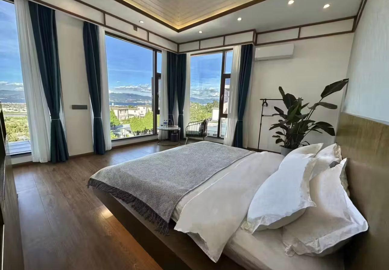 楽楽の民宿 | 部屋からは田園と洱海が見え、広々としたテラスがあります。